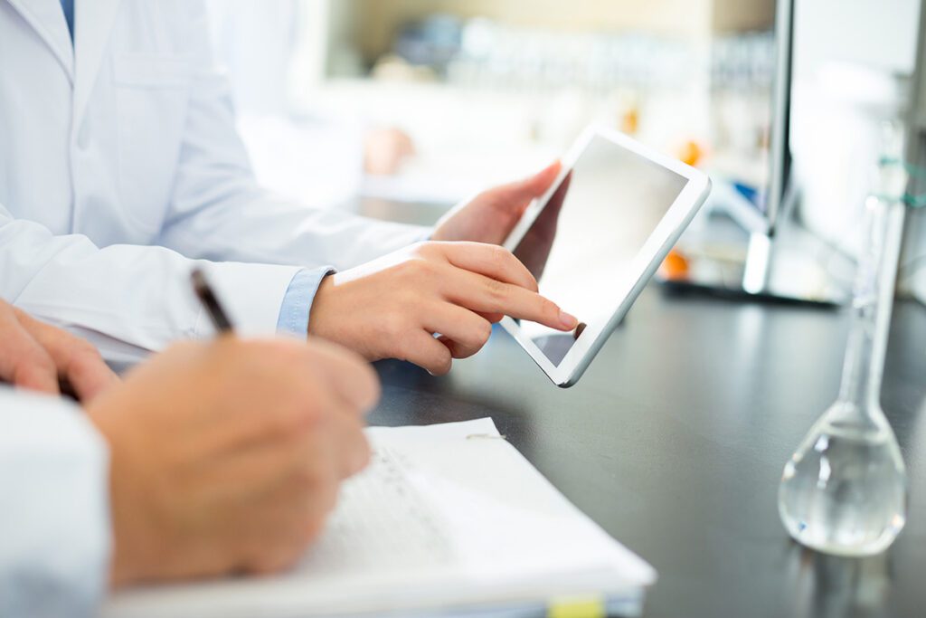 MiracleCord Cord Blood Lab Scientists Recording Stem Cell Processing Data